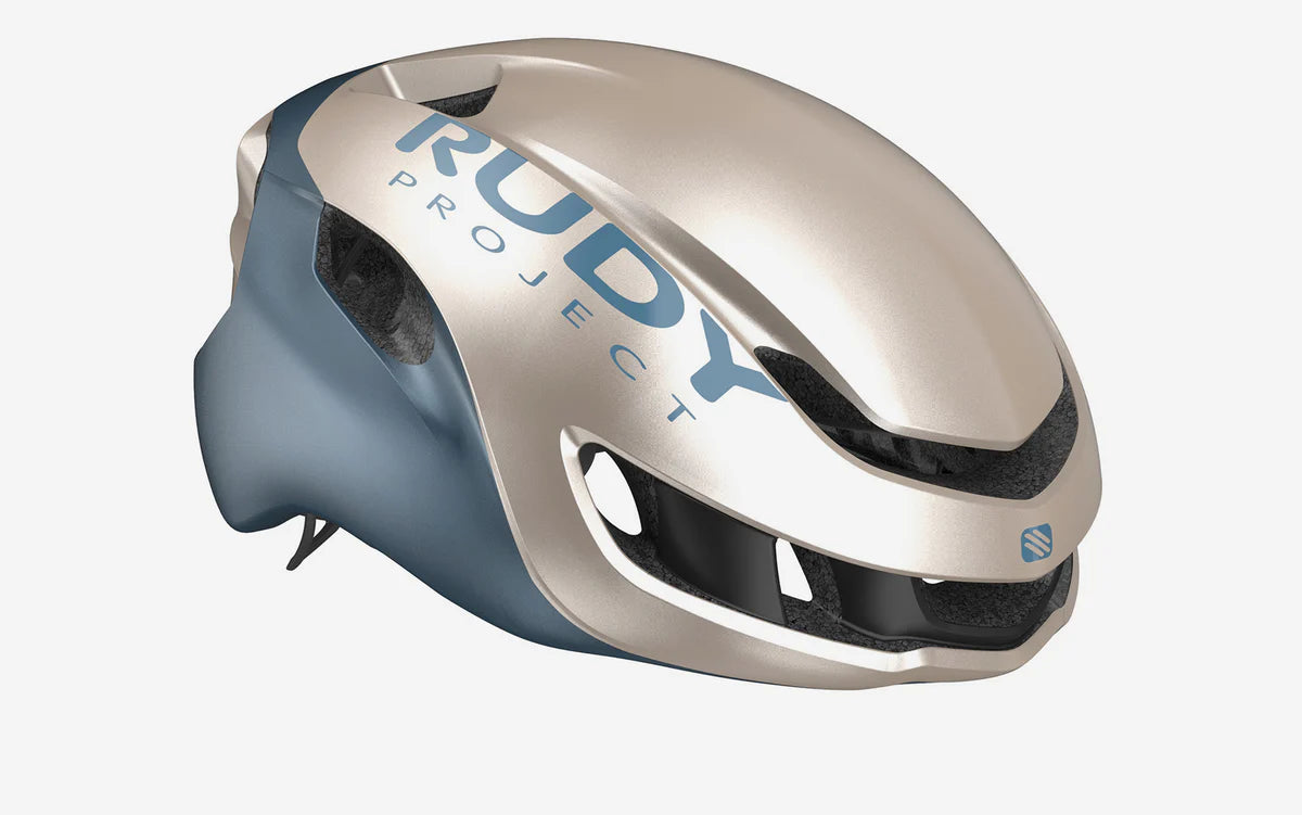 Casco de ciclismo Rudy Project Nytron champagne azul avio metal mate para ruta y competición