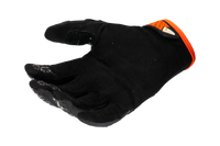 Detalle de inserciones de silicona para mejor agarre en guantes UFO Muria negro naranja